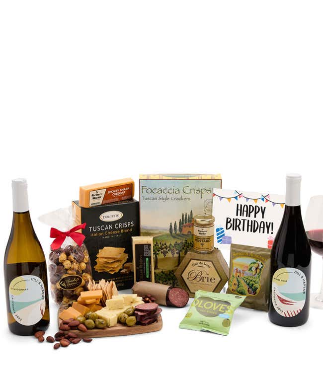 An abundant gift box filled with two bottles of California wine - red &amp; white, assorted crackers, three cheeses, summer sausage, snacks, and birthday card to make an amazing birthday spread.