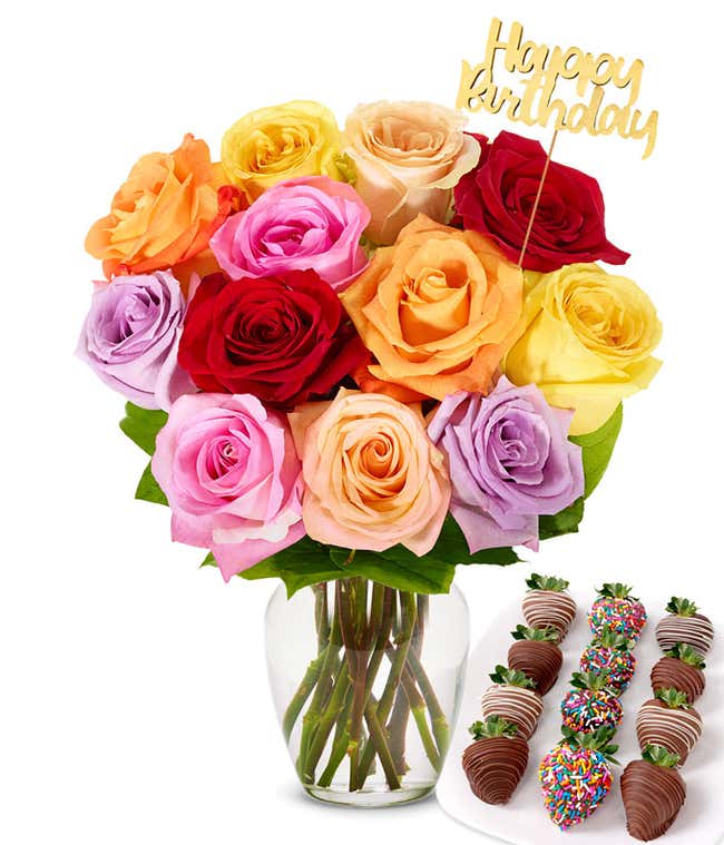 Assorted color roses with a gold pick saying Happy Birthday