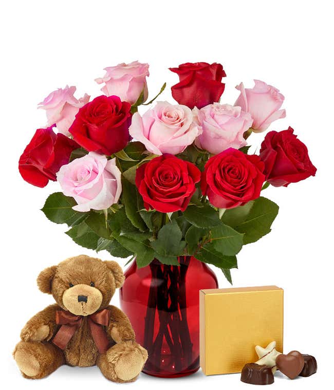 Pink and red roses with chocolates and a bear